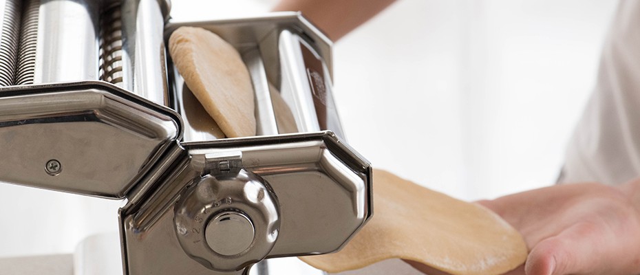 rolling pasta dough with machin