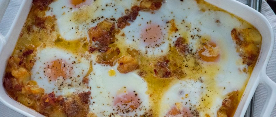 Eggs baked in ham and potato hush