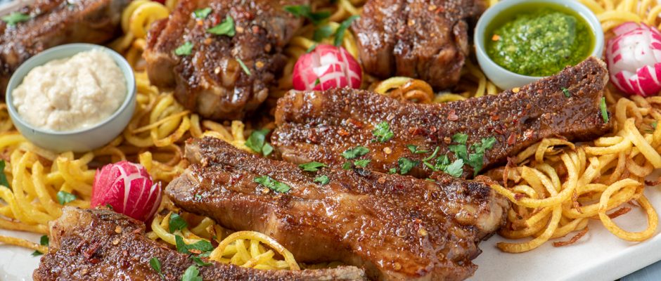 Glazed sticky pork ribs with apple cream sauce